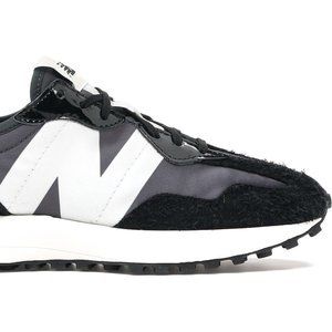 New Balance 327 sneakers in black and gray